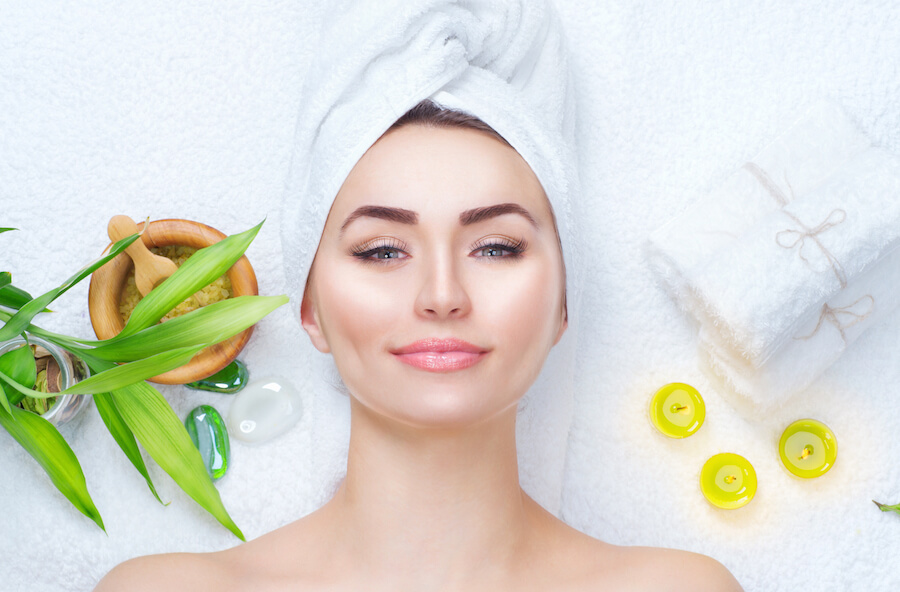 Skin specialist examining a patient’s skin during a professional consultation